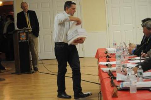 Tom Steele, an active opponent of a proposal to establish a rental registry in East Hampton Town, distributed information to the town board at a hearing on the proposal last week.