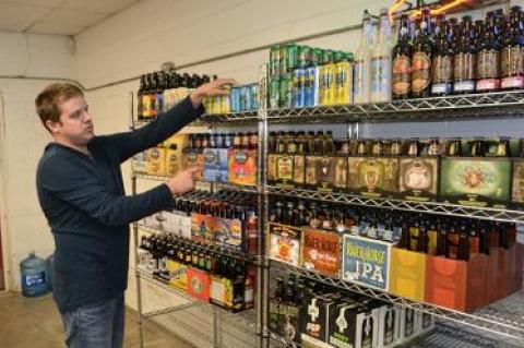 Brendan Worrell stocked the shelves last week at the beer and beverage store on Pantigo Place in East Hampton, soon to be called Hampton Beverage East.