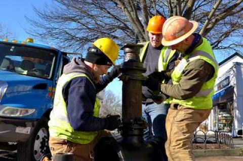 Workers on Newtown Lane, East Hampton, yesterday, part of a water authority project that will continue into the spring.