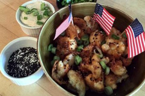 Buffalo cauliflower with a tangy scallion cream sauce is a tasty alternative to chicken wings.