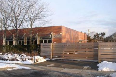 A fence Steven A. Cohen had built in front of his renovated building on Pantigo Road, East Hampton, was the subject of a planning board discussion on Feb. 9.