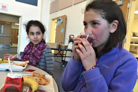 Jhoselin Narvaez Gutierrez, left, and Joana Gutierrez, fifth graders, chose smoothies made from strawberries, spinach, bananas, and apple juice during a recent lunch period at the John M. Marshall Elementary School.