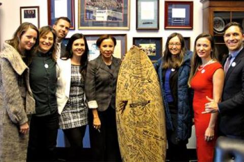 Representative Nydia Velazquez, center, was visited by, from left, Amanda Moore, Sommyr Pochan, Matt Gove, Nikita Scott, Joanna Malaczynski, Nicole Delma, and Jesse Spooner of the Surfrider Foundation. The group traveled to Washington last month to lobby for measures to protect the oceans and coastal areas.