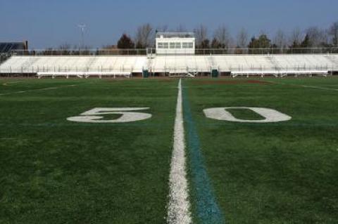 East Hampton High School’s football field, pictured here, is artificial turf. Plans to install a similar turf playing field at the Pierson Middle and High School have come under scrutiny by some parents.