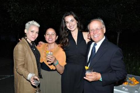 Bernard Kiembock, right, can often be seen on the summer benefit circuit sharing his family’s Dona Sarita mezcal with guests such as Kristin Houdlett, center. His daughter, Rebecca, and his wife, Sara Kiembock, are at left. The mezcal is best served with lime and orange juice in a chile salt-rimmed glass, according to the family.