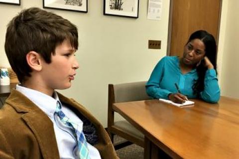 Harry Roussel of Sag Harbor, left, spoke about dyslexia with an aide to New York State Assemblywoman Catherine Nolan, who represents a district in Queens.