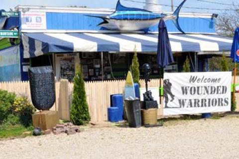 A new stockade fence will prohibit customers at Cyril’s Fish House, the popular roadside bar on Napeague, from spilling out onto the highway, as part of an agreement between owners of the property and the town.