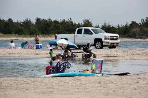 A resident of Springs told the East Hampton Town Trustees that the small beach just inside Three Mile Harbor is dangerously crowded with vehicles on some summer days.