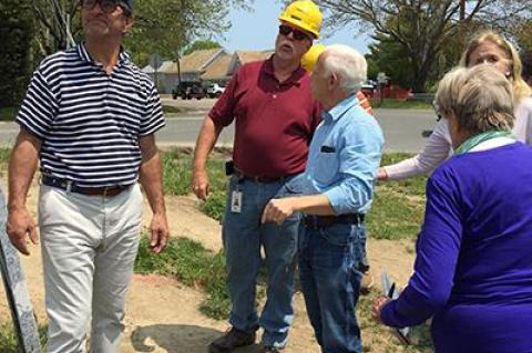 Contemplating prospective landscaping at the PSEG-Long Island electric substation in Amagansett Saturday were, from left, Michael Cinque of the Amagansett Village Improvement Society, Bob Parkinson, PSEG project manager, and Victor Gelb, Cathy Peacock, and Joan Tulp of A.V.I.S.