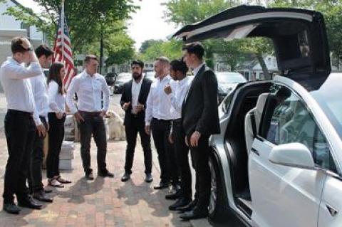 Staffers at the Tesla Motors gallery on Newtown Lane prepared to welcome visitors as a Model X sport utility vehicle stood ready for inspection and test drives.