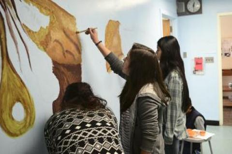 Students from East Hampton High School returned to the Springs School to paint a mural, under the auspices of the Anna Mirabai Lytton Foundation.