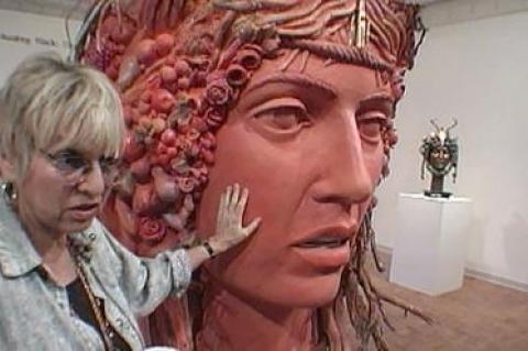 Lana Jokel captured Audrey Flack discussing her sculpture “Daphne” during her 1996 exhibition, “Daphne Speaks,” at Guild Hall.