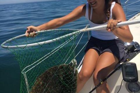 Anni Spacek, 13, caught a nine-pound fluke by the Shagwong buoy this week.