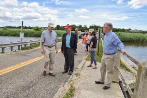 Assemblyman Fred W. Thiele Jr., right, State Senator Kenneth P. LaValle, center, and Sagaponack Mayor Don Louchheim after announcing state funding to help rehabilitate the 1932 bridge.