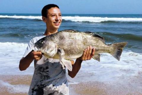 Robbie Downing, 15, caught a rare black drum at Hither Hills State Park.