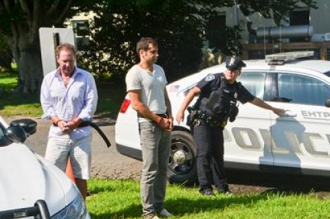 Chris W. Layton, left, and Sahm Adrangi, center, appeared in East Hampton Town Justice Court on Saturday following their drunken-driving arrests.