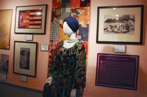 At least one of the dresses in the exhibition, above, should have a knotted opera-length pearl necklace, which Sara Murphy wore down her back as a signature look.  Gerald Murphy’s Chinese dragon robe, below, looks as vibrant as it did when he wore it.