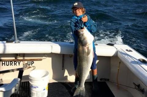 Bennett Burki, 10, caught a 35-pound striped bass off Montauk Point.