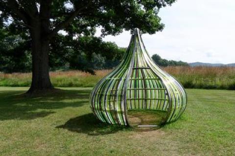 Dennis Oppenheim’s “Terrestrial Studio” exhibition at the Storm King Art Center includes outdoor installations from the artist’s estate, such as “Electric Kiss,” in stainless steel and colored acrylic rods, and “Entrance to a Garden,” which has a monumental sculpture in painted steel, along with the artist-designed landscape.