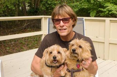 Patrick Christiano took in a late summer afternoon on his deck with Franki, left, and Tallulah.