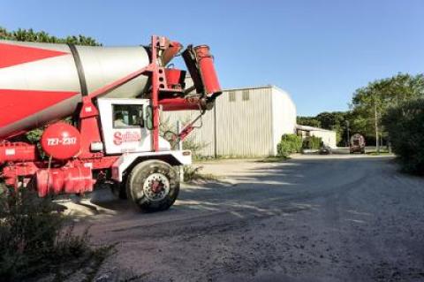 A cement truck pulled out of an industrial site in Wainscott on Tuesday in a commercial area that would be subject to a one-year building moratorium while East Hampton Town completes a planning study.