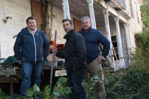 Mitch Winston and his brokers Christian Lipp, left, and Scott Strough, right, surveyed the property at 6 Union Street in Sag Harbor for the first time yesterday since Mr. Winston and a partner closed on their purchase of the house.