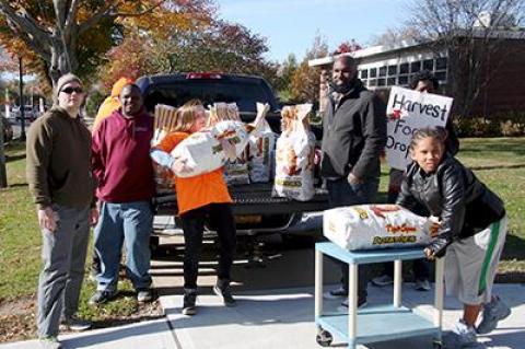 Strong volunteers lent a hand moving the 50-pound bags of potatoes donated to the East Hampton Food Pantry’s Harvest Food Drive by Foster Farm of Sagaponack on Saturday.