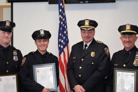 Chief Gerard Larsen, second from right, congratulated officers who helped save the life of a man who collapsed at the Maidstone Club in September, from left, Officer Matt Kochanasz, Officer Steven Niggles, and Sgt. Richard Mamay.