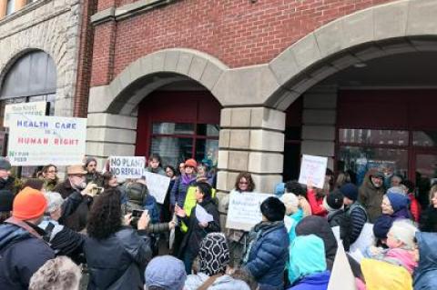 Constituents rallied outside Representative Lee Zeldin’s office in Riverhead on Tuesday.