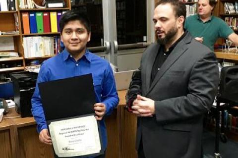 Kevin Chabla, a regional Scripps Spelling Bee runner-up, with Eric Casale, the Springs School principal