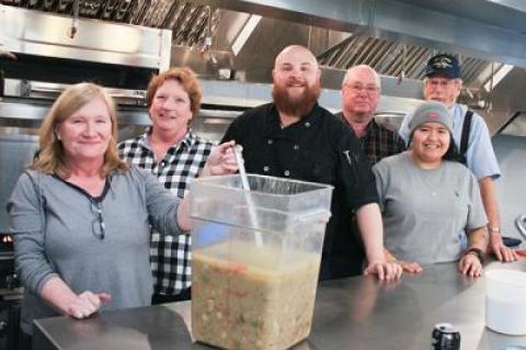 Volunteers gathered in the Scoville Hall kitchen to prepare for the annual soup and chili dinner sponsored by the Amagansett Presbyterian Church with contributions from Nick and Toni’s and Bostwick’s, among others. At Almond, its co-owner and head chef, Jason Weiner (below preparing headcheese for the first course), collaborated with Jeremy Blutstein from East by Northeast to concoct a “whole animal, cured, pickled, fermented, and preserved-things beer dinner.”