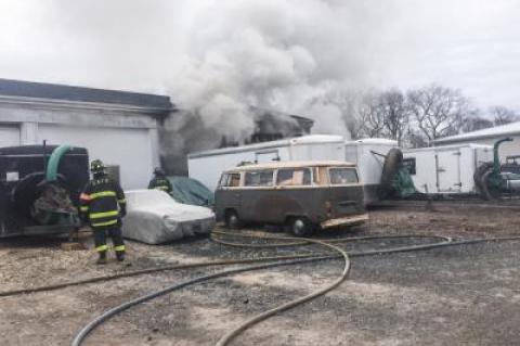 A fire broke out Tuesday morning in a bay of a commercial building that was rented out by a landscaping company.