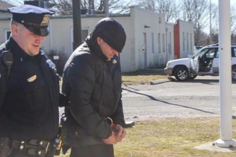 Jefferson Davis Eames was led into East Hampton Town Justice Court last Thursday afternoon for his arraignment on a felony charge of grand larceny.