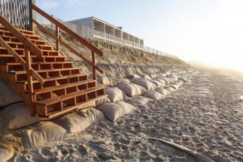 The sandbag wall on Montauk’s downtown beach will be repaired and covered with sand by contractors for the Army Corps of Engineers one more time.