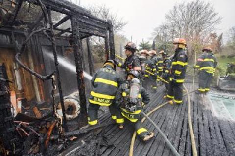 A pool house on a Georgica Road property was destroyed by flames on Tuesday. Fire officials said it had been burning a while before a passerby noticed.