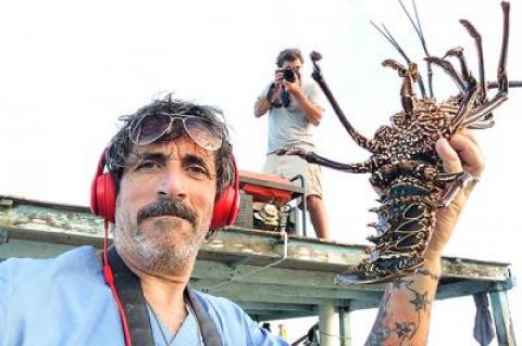 Dell Cullum, seen here on a film and photography expedition to the Galapagos with Billy Strong, has been temporarily sidelined after injuring his back during a fall from a ladder last week.