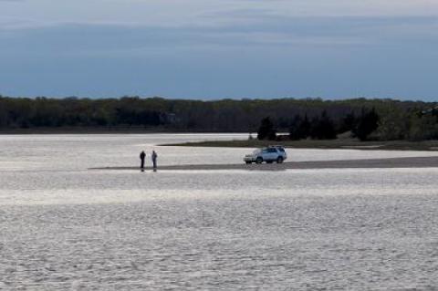 Two fishermen took a pause from casting to talk at Gerard Point on Monday evening. Reports were that big bluefish have been landed there and at other bay beaches since Saturday.