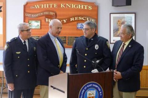 P.J. Cantwell, third from left, an East Hampton Village public safety dispatcher, was promoted to supervisor, and was honored at the village board meeting on Friday by acting police chief Michael Tracey, Richard Lawler, a village board member, and Mayor Paul F. Rickenbach Jr.