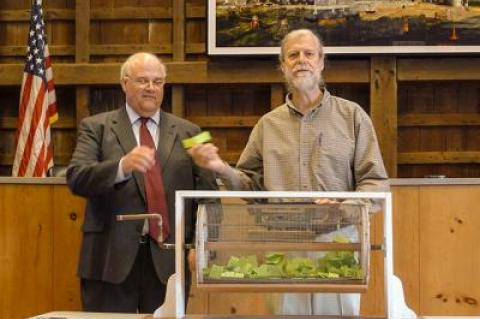 Tom Ruhle of East Hampton Town’s Office of Housing and Community Development and the Rev. Steven Howarth pulled “winning tickets” during a home ownership lottery drawing on May 31 at East Hampton Town Hall.