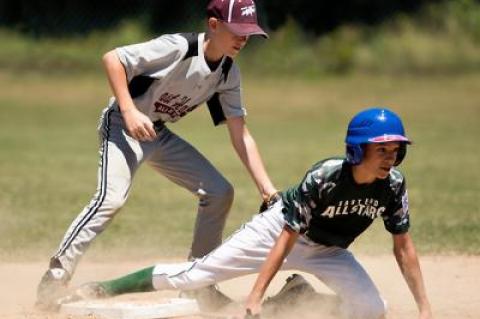 Eli Wolf, the Grey team’s shortstop, put the tag on an East End base runner in the second inning of an 11-to-12-year-old Little League playoff game at the Pantigo Fields.