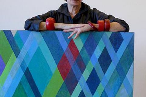 Arlene Slavin with one of the works from her “Intersections” series