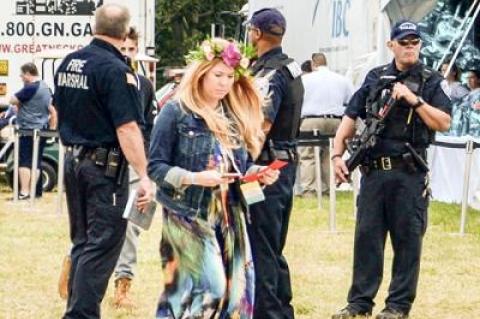 At Super Saturday in Bridgehampton, a benefit for the Ovarian Cancer Research Fund, Southampton Town police officers stood by with semiautomatic rifles.