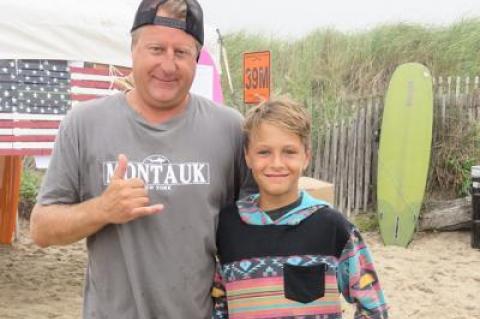 Craig Lieder congratulated his son, Chase, on getting first place in menehune short board contest and two third-place finishes in boys long board and open long board at the Rell Sunn Surf Contest at Ditch Plain Beach on Sunday.