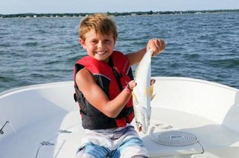 Mason Mannino, 10, of Sag Harbor held a weakfish he caught in Noyac Bay.