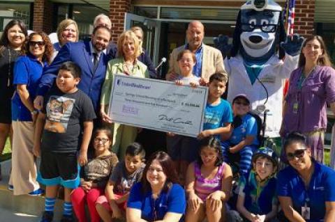 Representatives from United Healthcare presented the Springs School with a check for $3,500 to officially launch the Springs chapter of Blessings in a Backpack, which helps feed schoolchildren on weekends.