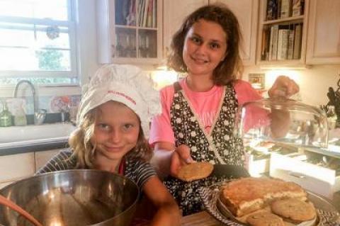 Beatrice Flight donned a chef’s hat while her older sister, Scarlett, supervised as the two prepared for a bake sale at the Montauk School to help Houston’s Fonwood Early Childhood Center recover from Hurricane Harvey.