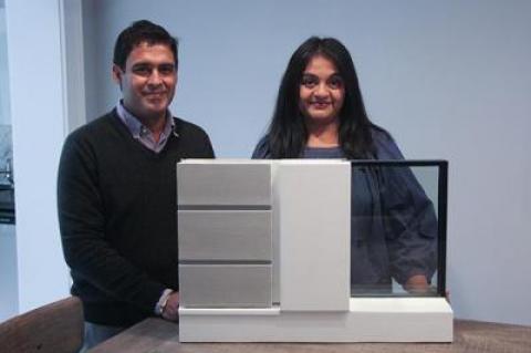 Punit Chugh and Anjali Gupta display a model of a premade wall. Below, this modernist Davinci Haus was custom designed.