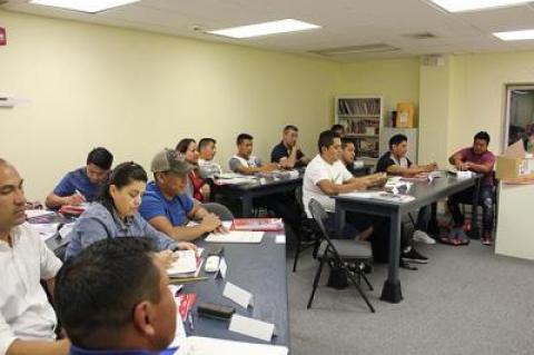 Louise Bergerson’s English as a second language class used mini white boards to practice spelling and writing numbers during the second session of the academic year.