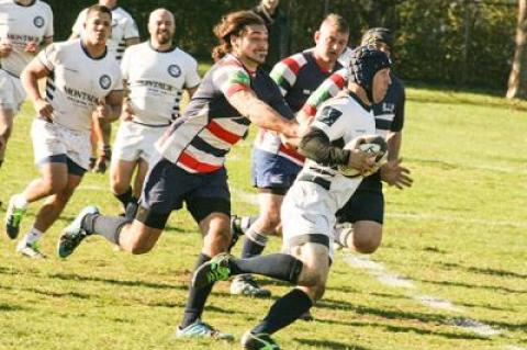 Kevin Brabant, with the ball, was one of a number of Montauk forwards and backs to reel off long gainers in Saturday’s 60-29 rout of the Suffolk R.C. at East Hampton’s Herrick Park.	Jack Graves