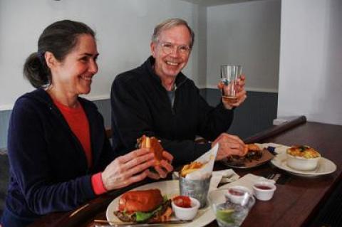 Cynthia and John Kaufmann sampled a pulled pork slider and a veggie burger at the Springs Tavern.